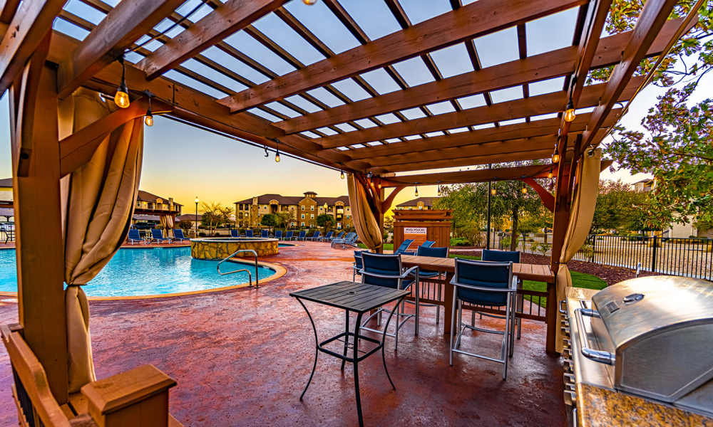 Barbeque grill beside pool at Sunset Lodge in Odessa,Texas