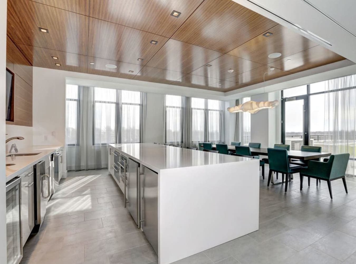 Dining area with kitchen at Solaire 7077 Woodmont in Bethesda, Maryland