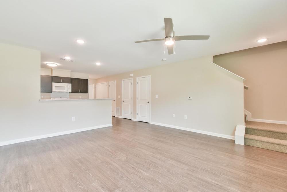 Spacious living room with wood flooring at Canaan Crossing in Madison. GA