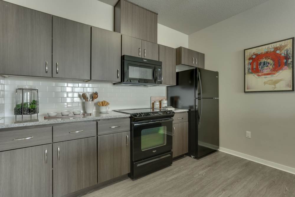 Kitchen with stainless-steel appliances at Terrene at the Grove in Wilsonville, Oregon 
