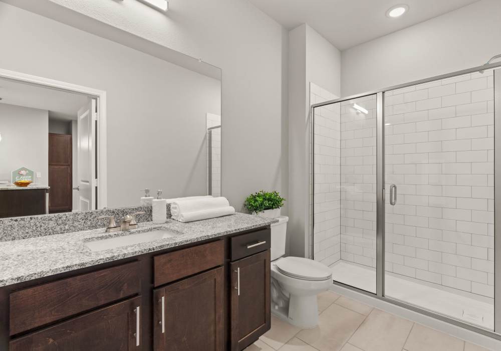 Bathroom with glass shower enclosure at Walnut Springs in Seguin, Texas