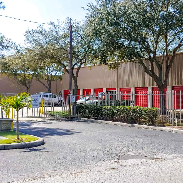 Gated access to outdoor storage units at StorQuest Self Storage in Tampa, Florida