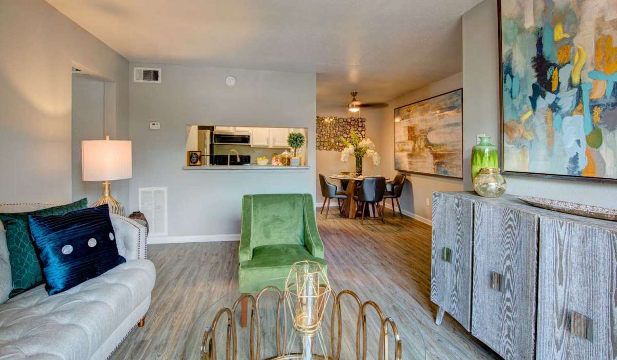 Well-furnished modern apartment with faux wood flooring at University Green Apartments in Houston, Texas