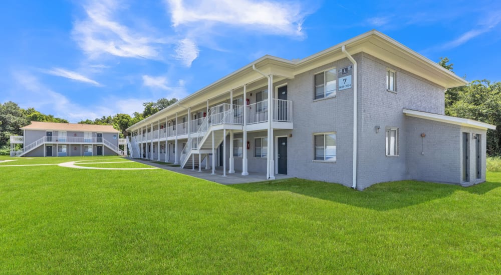 Exterior with greenspace at The Laurel in Pensacola, Florida