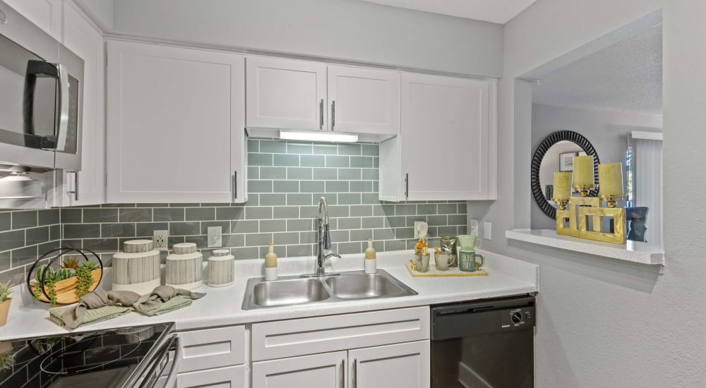 Model home kitchen with modern appliances at The Hampton on Jupiter in Dallas, Texas