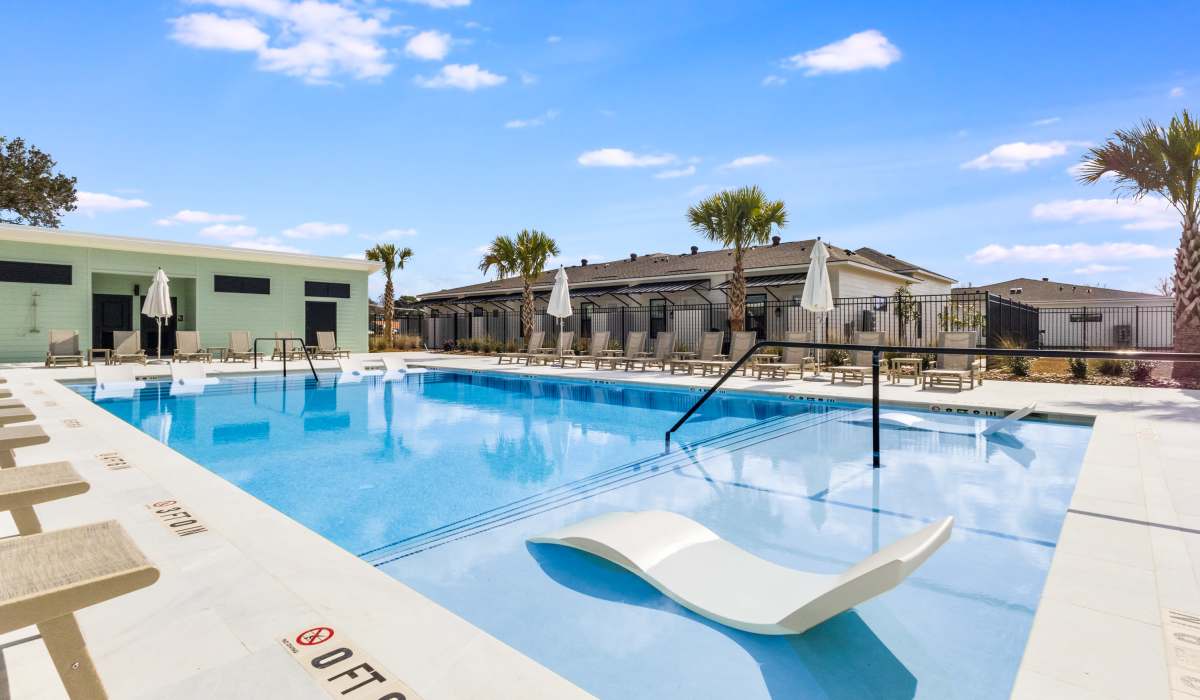 Swimming pool with lounge chairs at Lakewood Villas in Bossier City, Louisiana 