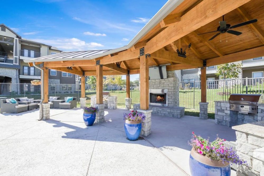 Outdoor fireplace and BBQ ready to grill up some burgers at Verandas at Alamo Ranch in San Antonio, Texas