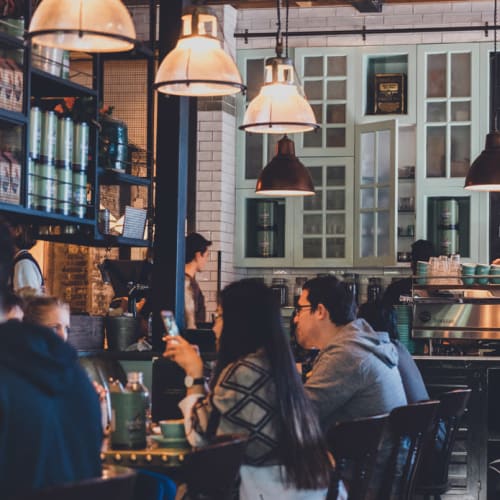 People eating at a restaurant near The One Atlantic in Stamford, Connecticut