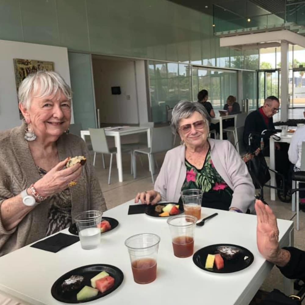 Residents enjoying snacks at Inspired Living Tampa in Tampa, Florida. 