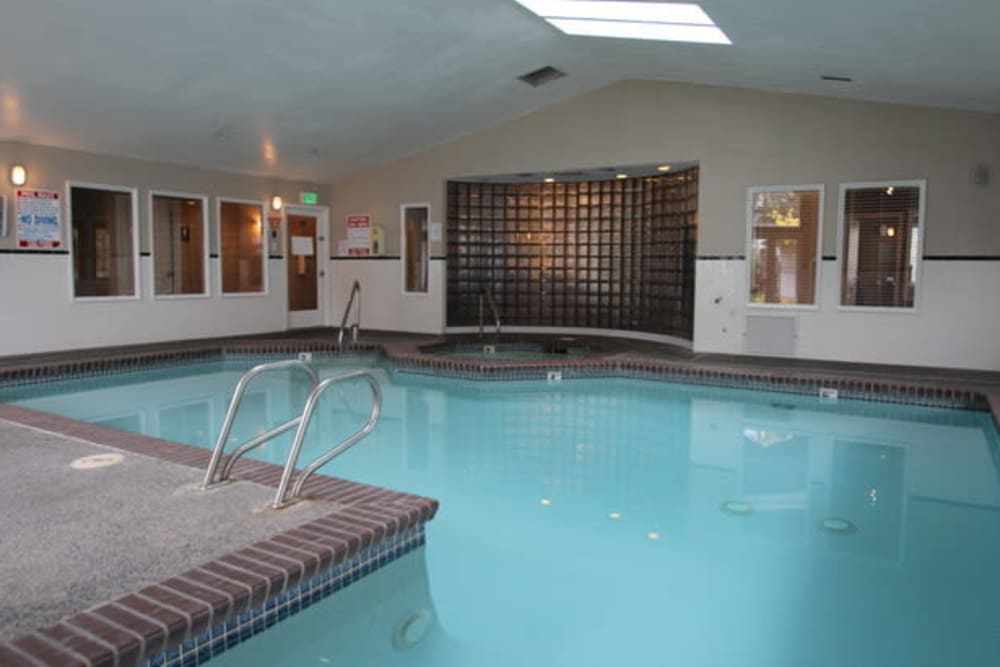 Indoor swimming pool with a hot tub at Autumn Chase in Bothell, Washington