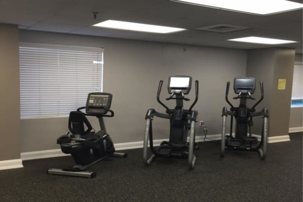 A resident gym with a variety of workout stations at Westwood Tower Apartments in Bethesda, Maryland