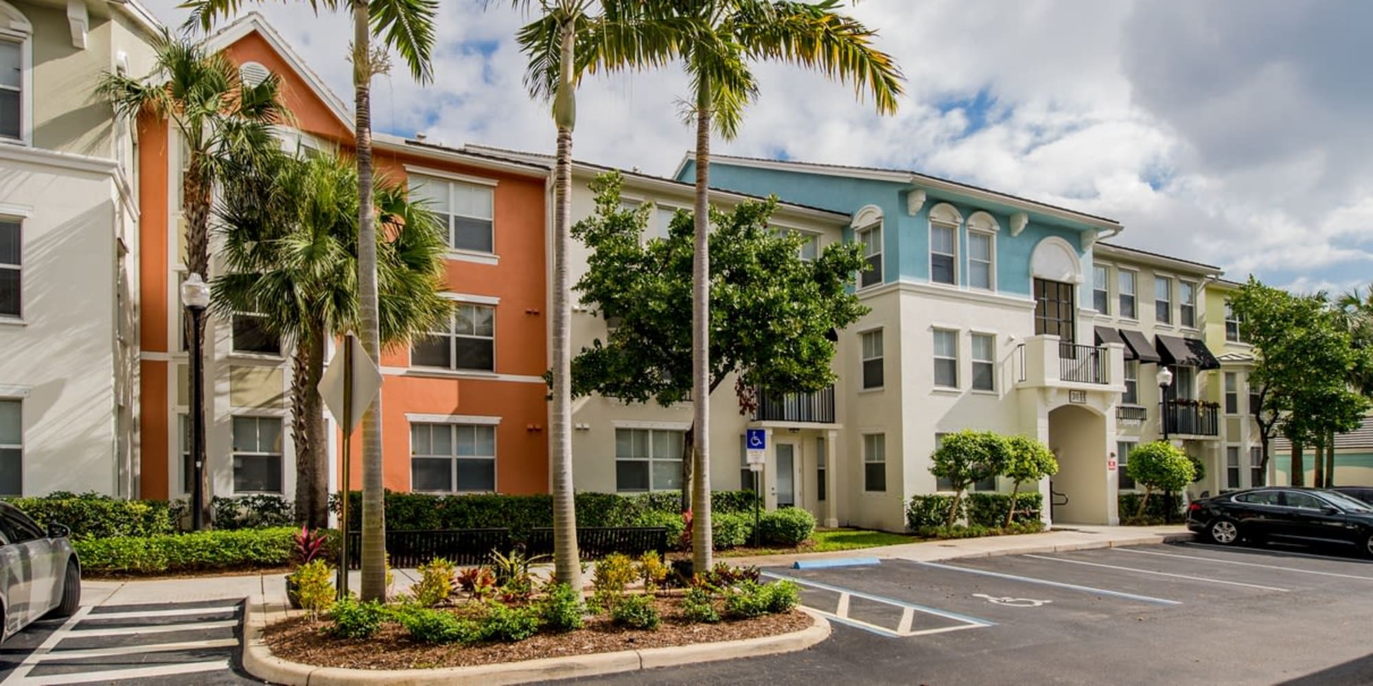 Exterior view of gorgeous colorful building and palm trees at The Pearl in Ft Lauderdale, Florida