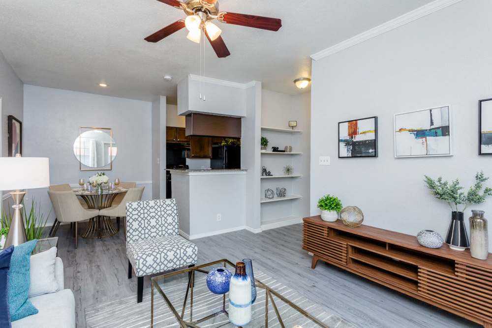 Open-concept of kitchen and living room at Green Tree Place in Houston, Texas