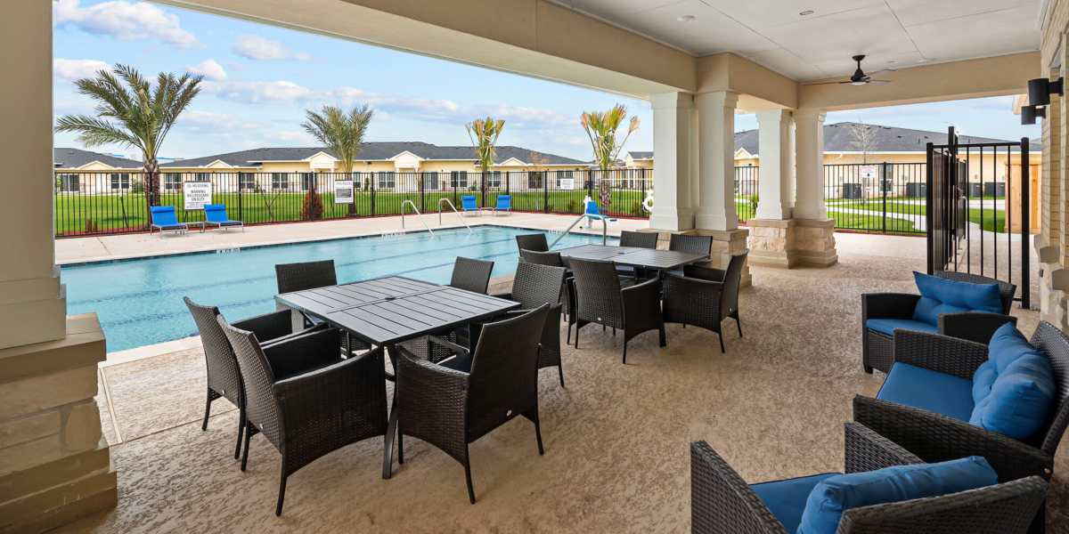Pool area with lounge seating at Springwood at Aliana in Richmond, Texas