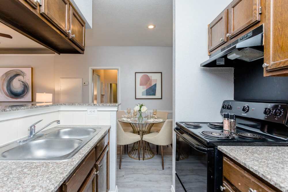 Well-equipped kitchen at Green Tree Place in Houston, Texas