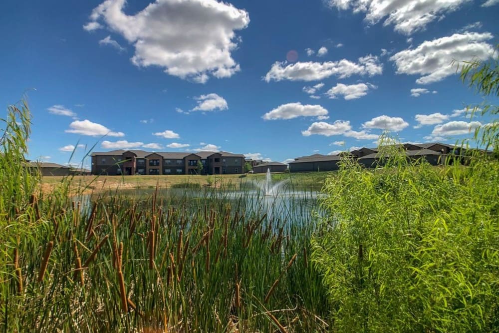 View of the lake and buildings at The BLVD in San Angelo, Texas