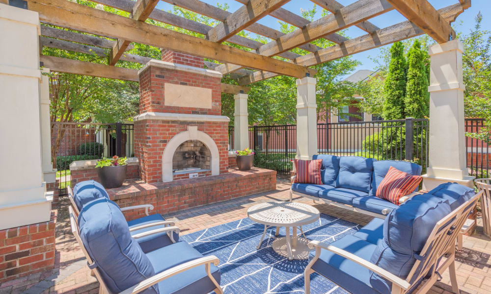 Outdoor fire pit and lounge chairs poolside at The Vive in Kannapolis, North Carolina