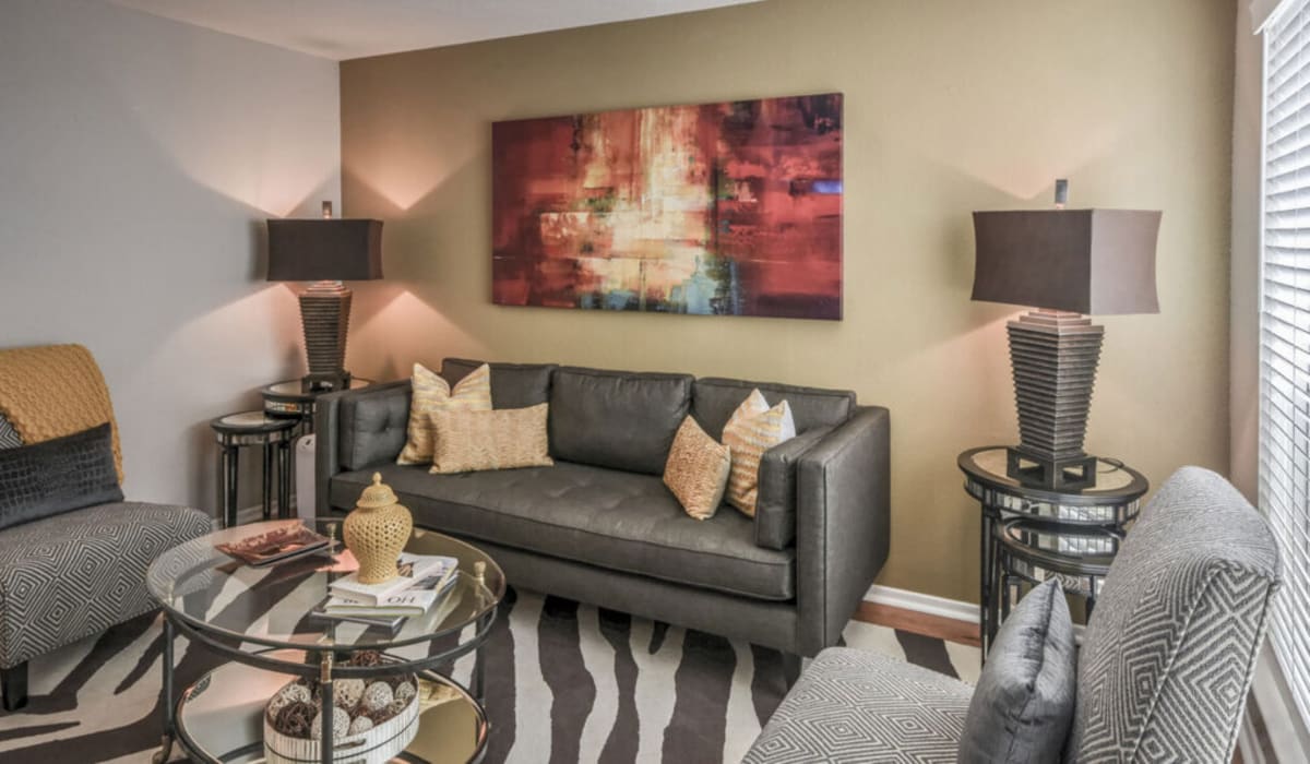 Modern living room with striped rug at Oaks of Timbergrove in Houston, Texas