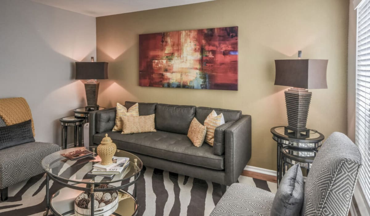 Modern living room with striped rug at Vintage at 18th Street in Houston, Texas