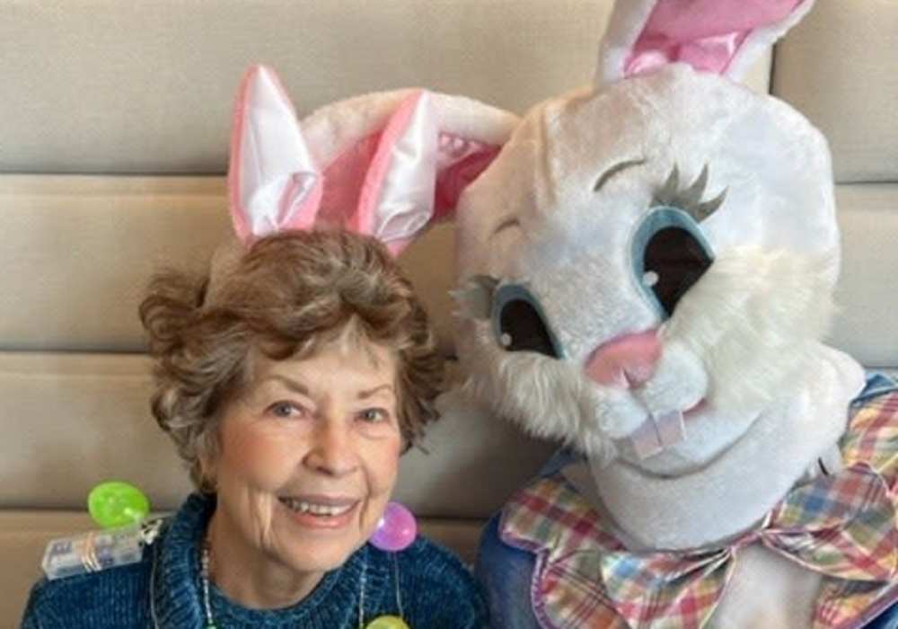 Resident posing with the Easter Bunny at Turners Rock in Springfield, Missouri
