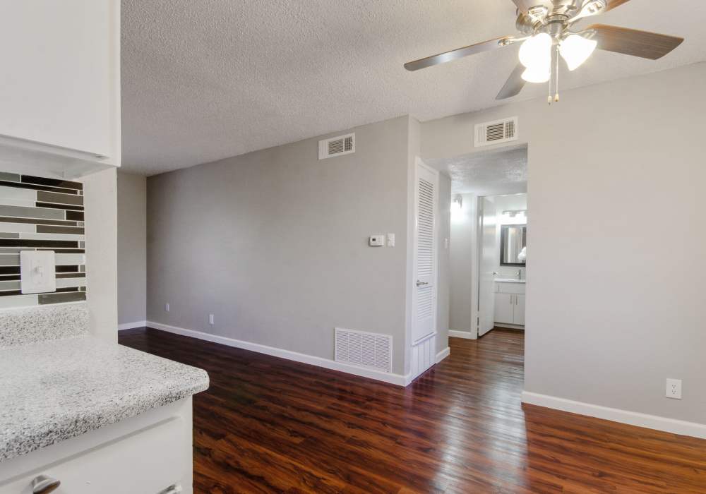 Living room with ceiling fans at 1000 Mary Apartment Homes in Iowa Park,Texas
