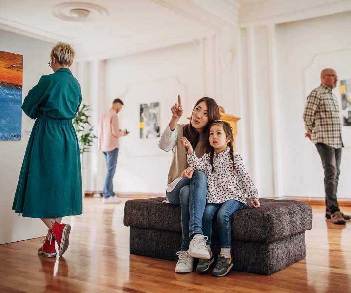 Mother and daughter exploring a museum close to Village at Town Park in Hampton, Virginia