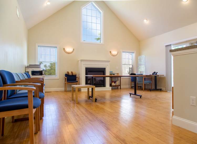 Community room with gas fireplace at Marion Village Estates in Marion,Massachusetts