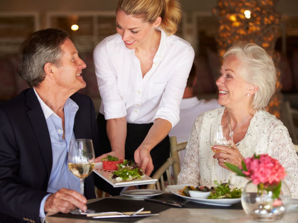 Residents chatting over dinner at The Vista in Esquimalt, British Columbia