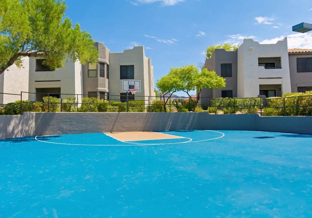 Exterior of community buildings in basketball court at Cabrillo Apartments in Scottsdale, Arizona