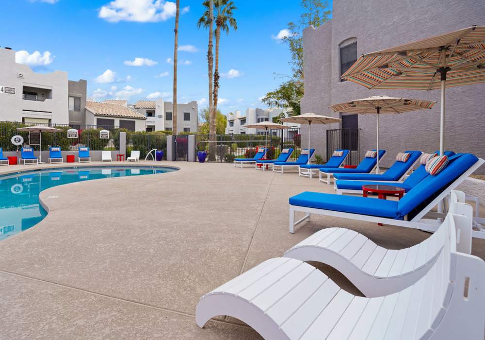 Lounge chairs by the pool at Cabrillo Apartments in Scottsdale, Arizona