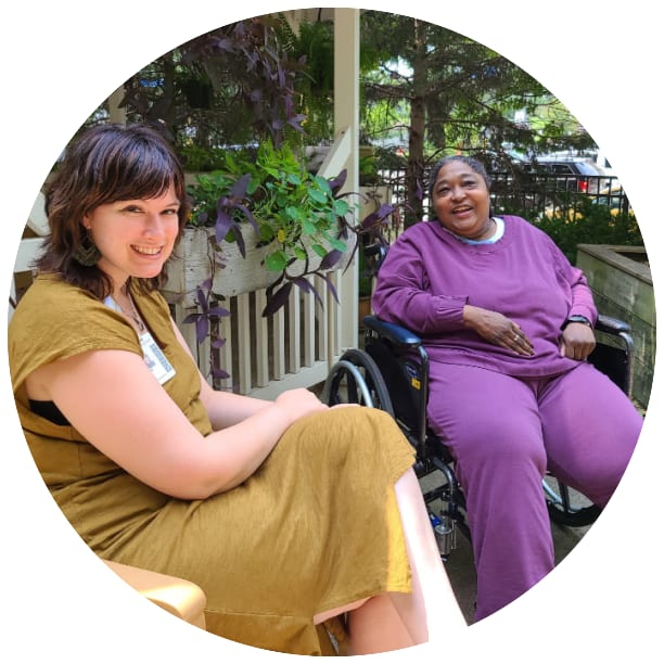 Resident and a guest laughing outside at Ebenezer Senior Living in Edina, Minnesota