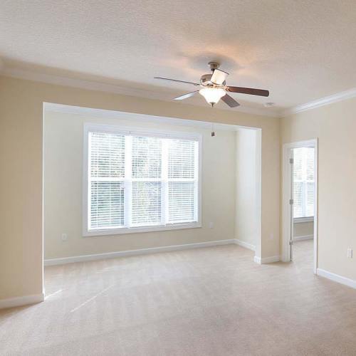 Spacious bedroom with a window at Seasons at Poplar Tent in Concord, North Carolina
