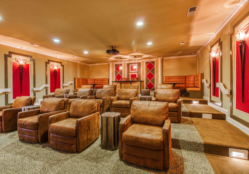 Luxurious community movie theater with reclining chairs and end tables for drinks and snacks at Glass Creek in Mt Juliet, Tennessee