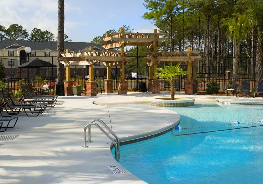 Pool, sunning area and gazebo at Deer Meadow Village in Columbia, South Carolina