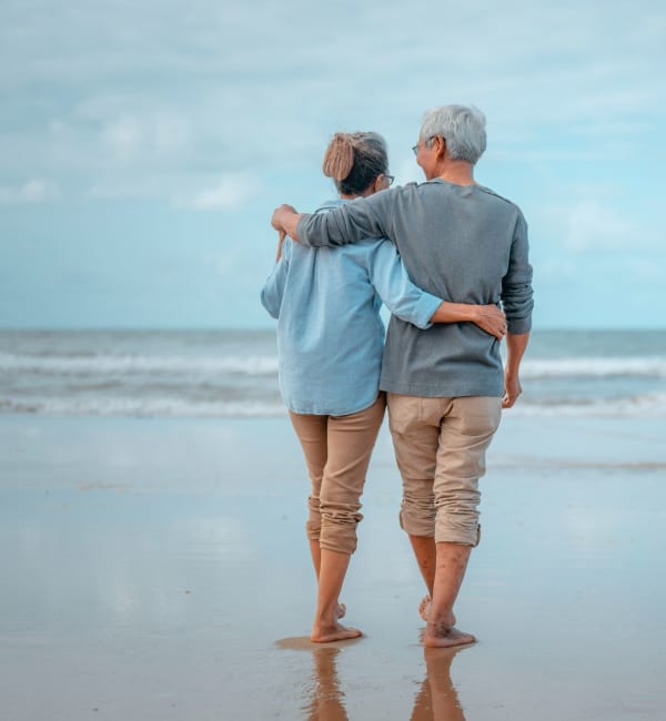 A couple at the beach at Steward + Helm