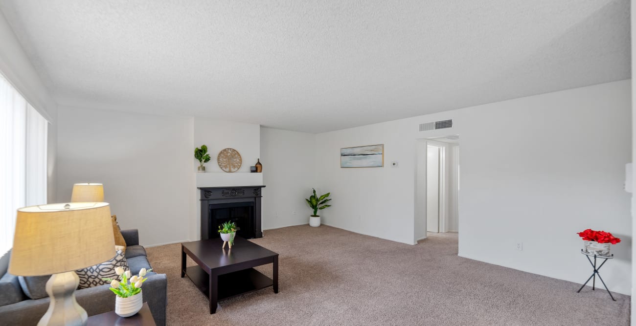 Spacious living room at the Hallmark Apartment in Sherman Oaks with fireplace