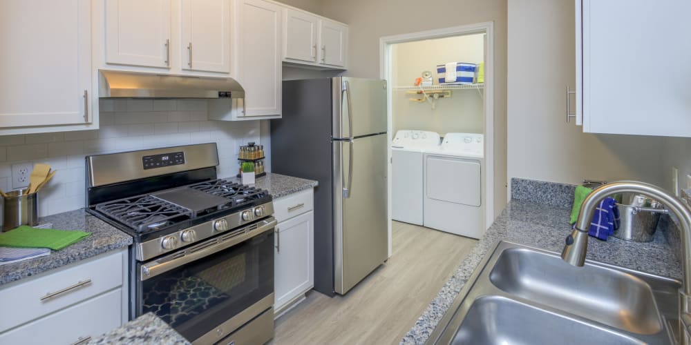 Modern kitchen with stainless-steel appliances in a model home at The Mark in Raleigh, North Carolina