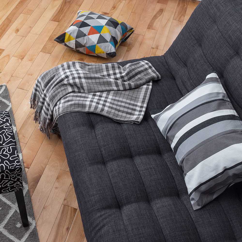 Comfortable living room with large couch at Coddington Point in Newport, Rhode Island