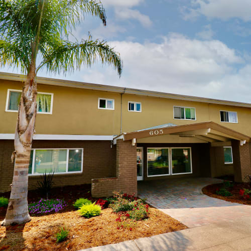 Apartment complex exterior at Coral Gardens Apartments in Hayward, California