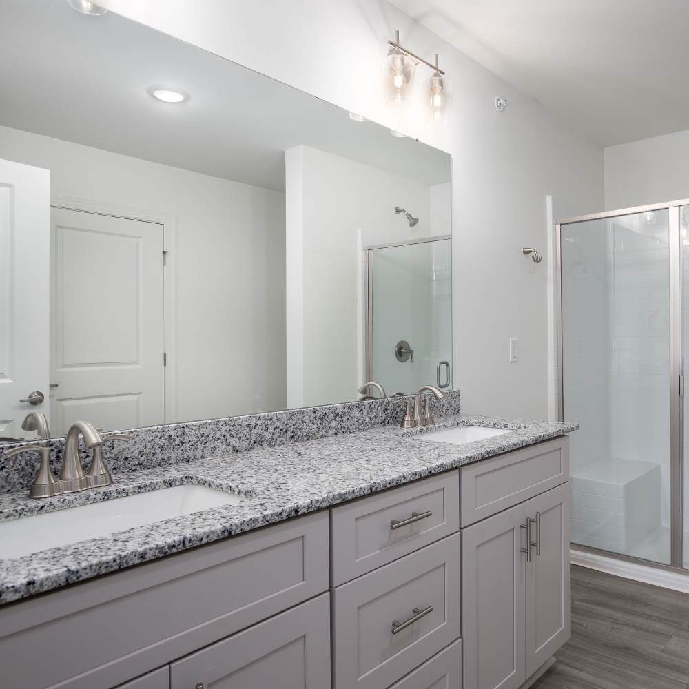 Bright bathroom with mirror and storage space at Retreat at Redstone in Crestview, Florida