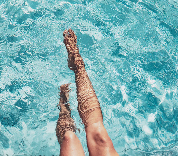 A women enjoying the luxurious rooftop pool at The Columbia at the Waterfront in Vancouver, Washington