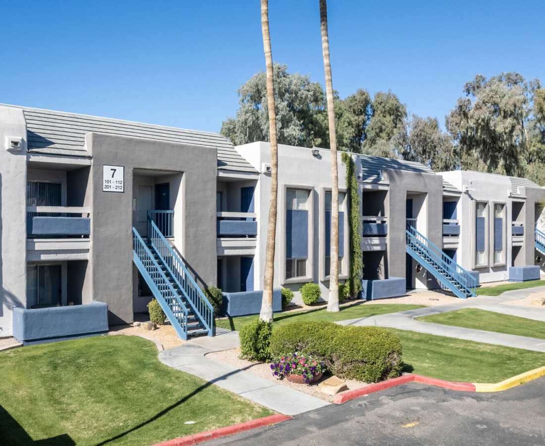 Exterior shot of the complex with beautiful lawns at 544 Southern Apartments in Mesa, Arizona