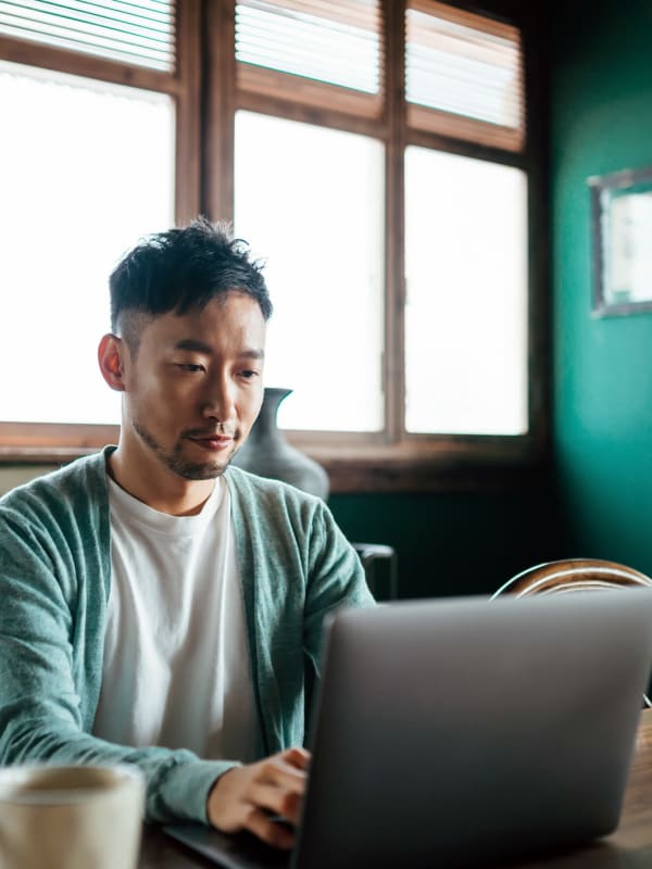 a resident working from his laptop near  Columbia View in Vancouver, Washington