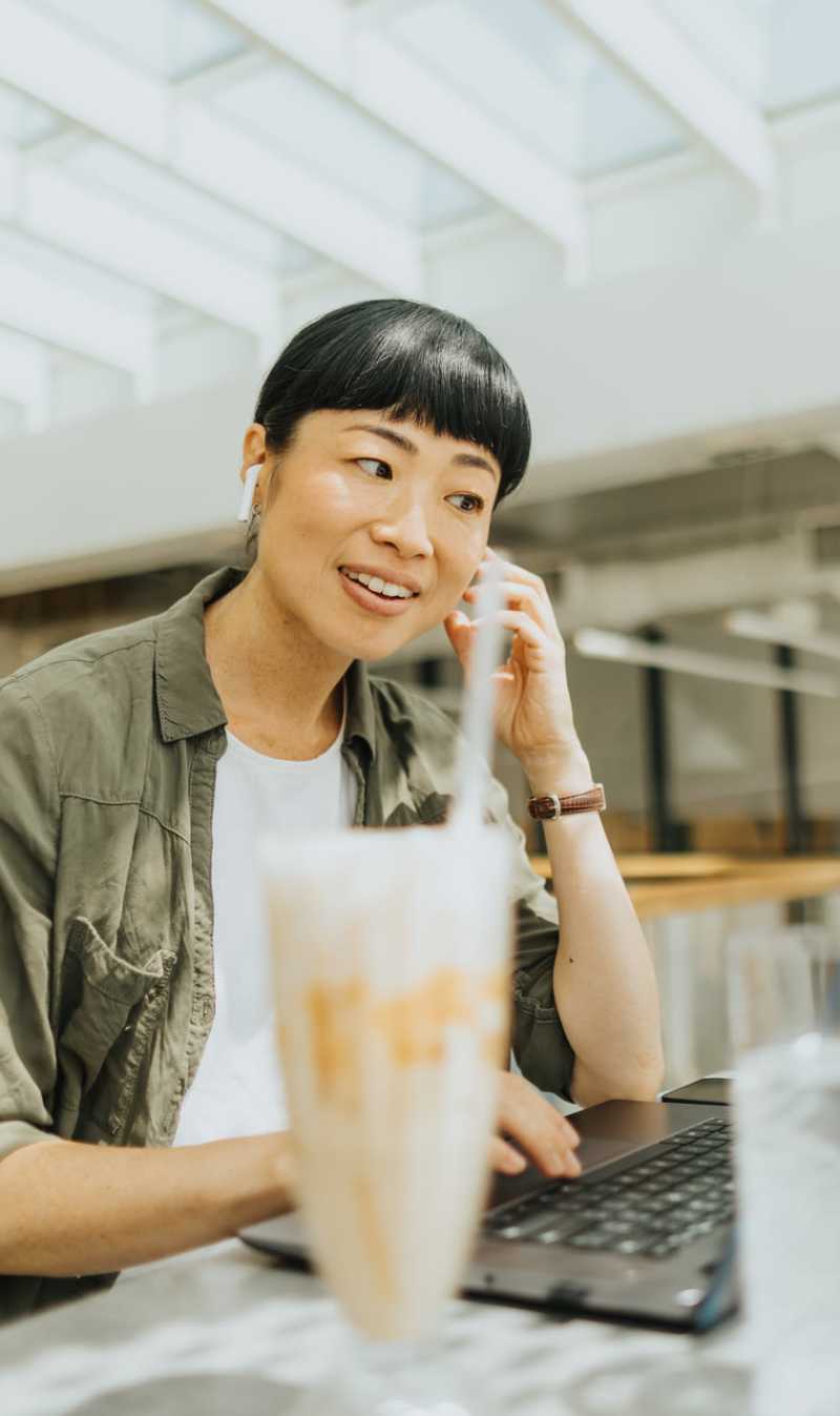 Resident working from a coffee shop near Stone Village Apartments in Reno, Nevada