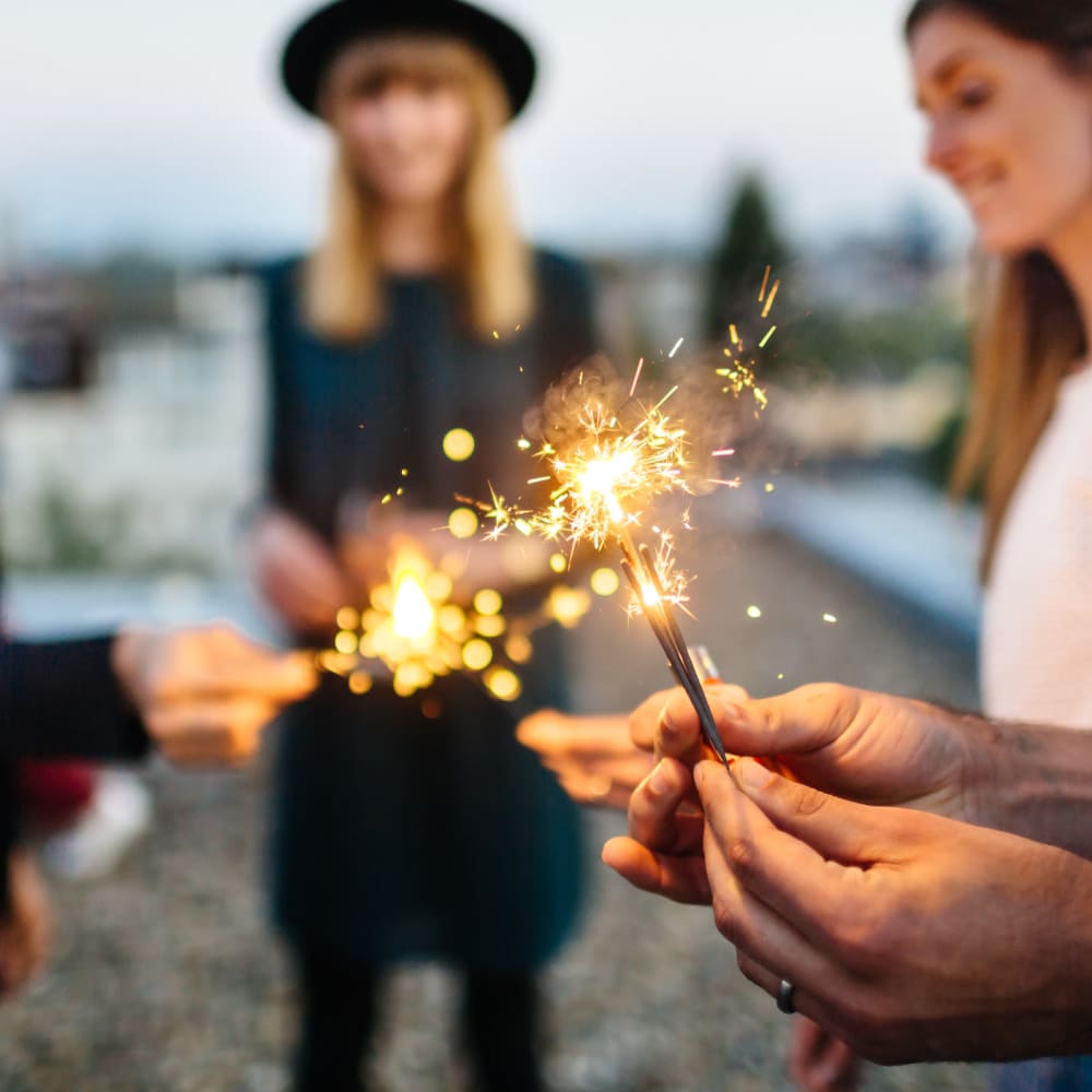 Residents playing with sparklers at Bridgeview Apartments in San Diego, California