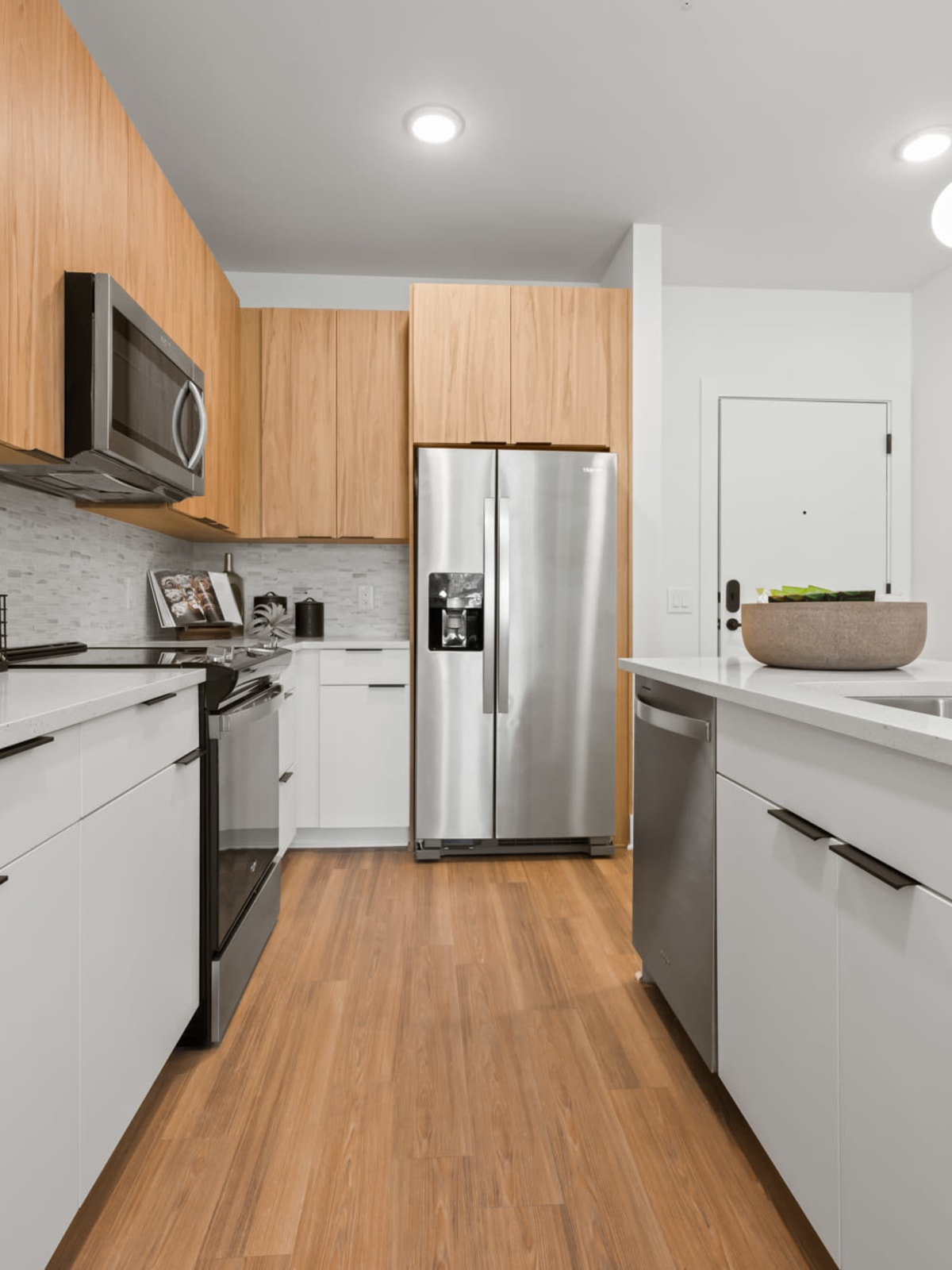 Gourmet kitchen with honed granite countertops and stainless-steel appliances at The Scottie in Nashville, Tennessee 