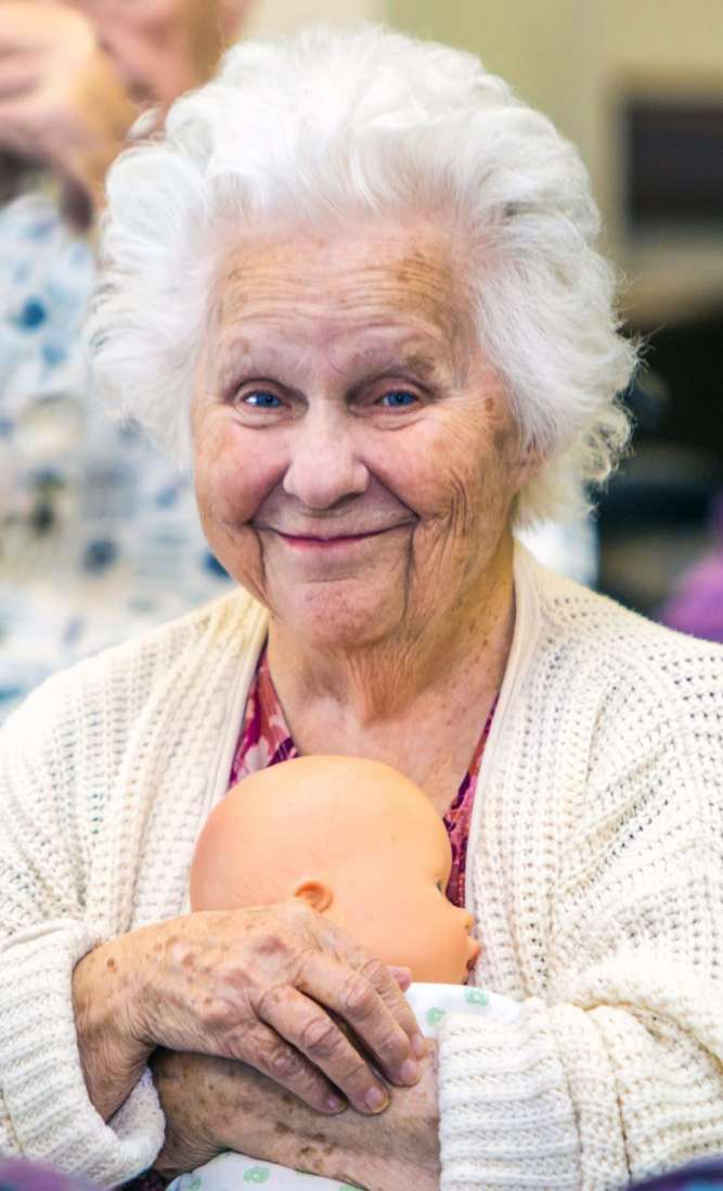 Resident holding doll  at Dougherty Ferry in Valley Park, Missouri