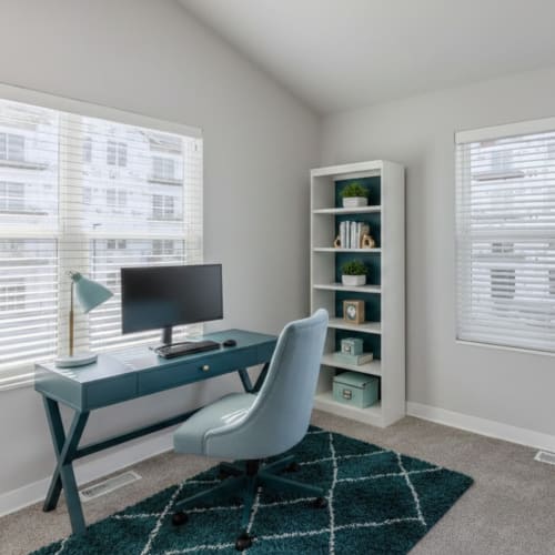 Bedroom turned office with ceiling fan at Union Court Senior Apartments and Townhomes in Kenosha, Wisconsin