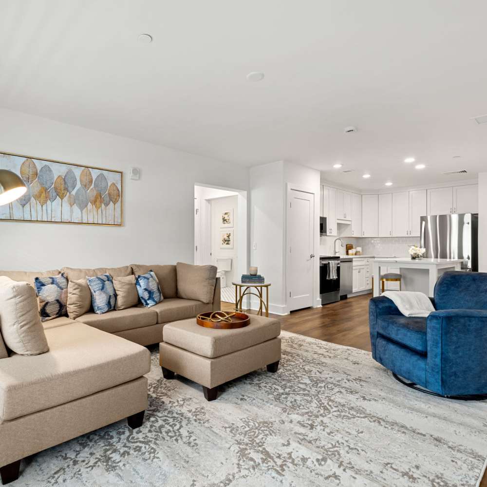 A spacious living room with couch and chairs at Culver Street in Newington, Connecticut