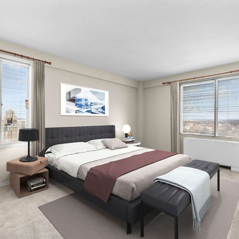 Spacious and inviting bedroom featuring modern decor and stunning city views at The View at Forest Park in St. Louis, Missouri